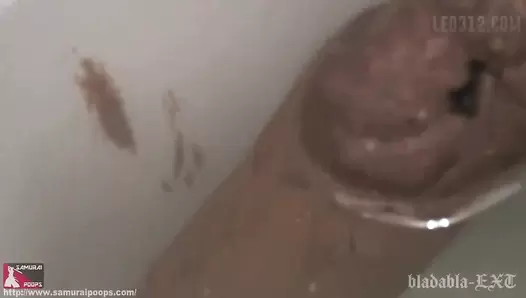 UNKW-039 02 Close-up face and poop. Double view toilet excretion