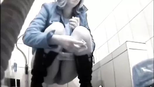 Girl in black boots scat squatting