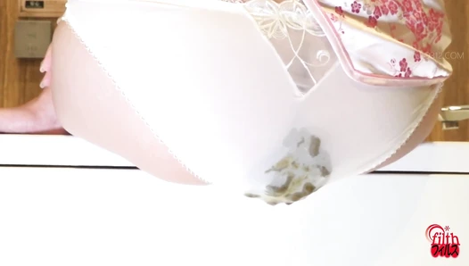 FF-686 02 Girls pantypooping: clear poop accumulating in see-through panties.