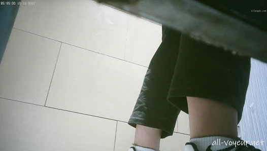 Sneak shot of women's restroom in shopping mall 18